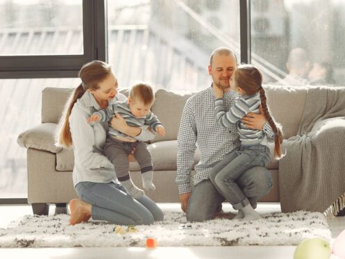 family enjoying clean indoor air in a modern living room in Glendale AZ