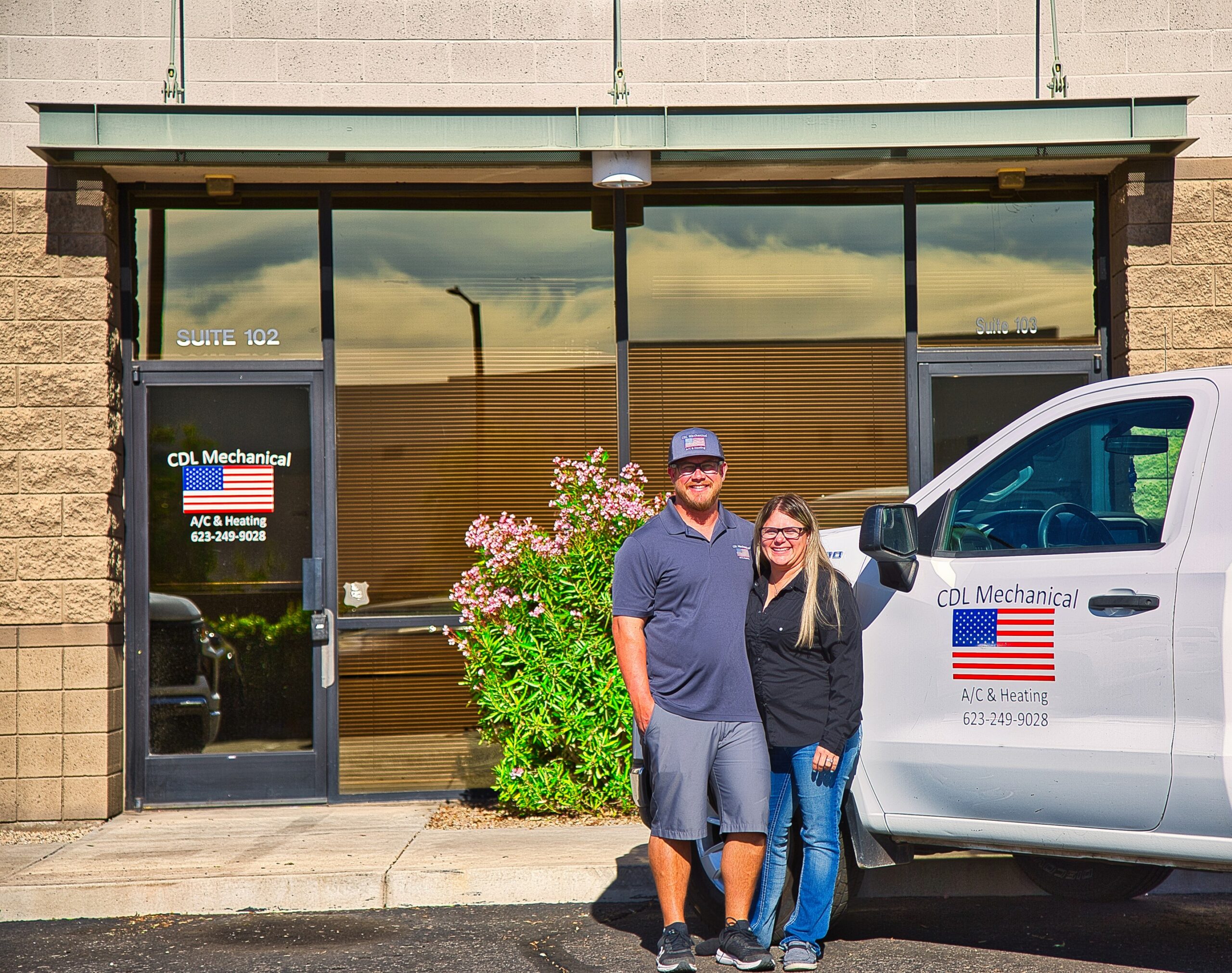 Josh and Danielle next to truck